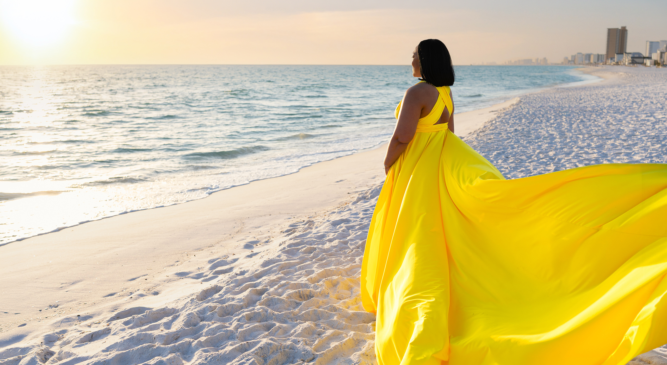 Karen2_wide Woman in a yellow flying dress on a white-sand Florida Gulf Coast beach